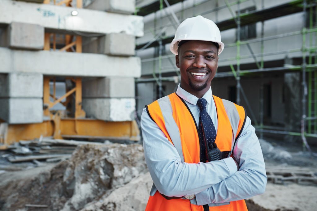 Portrait of a confident young man working at a construction site